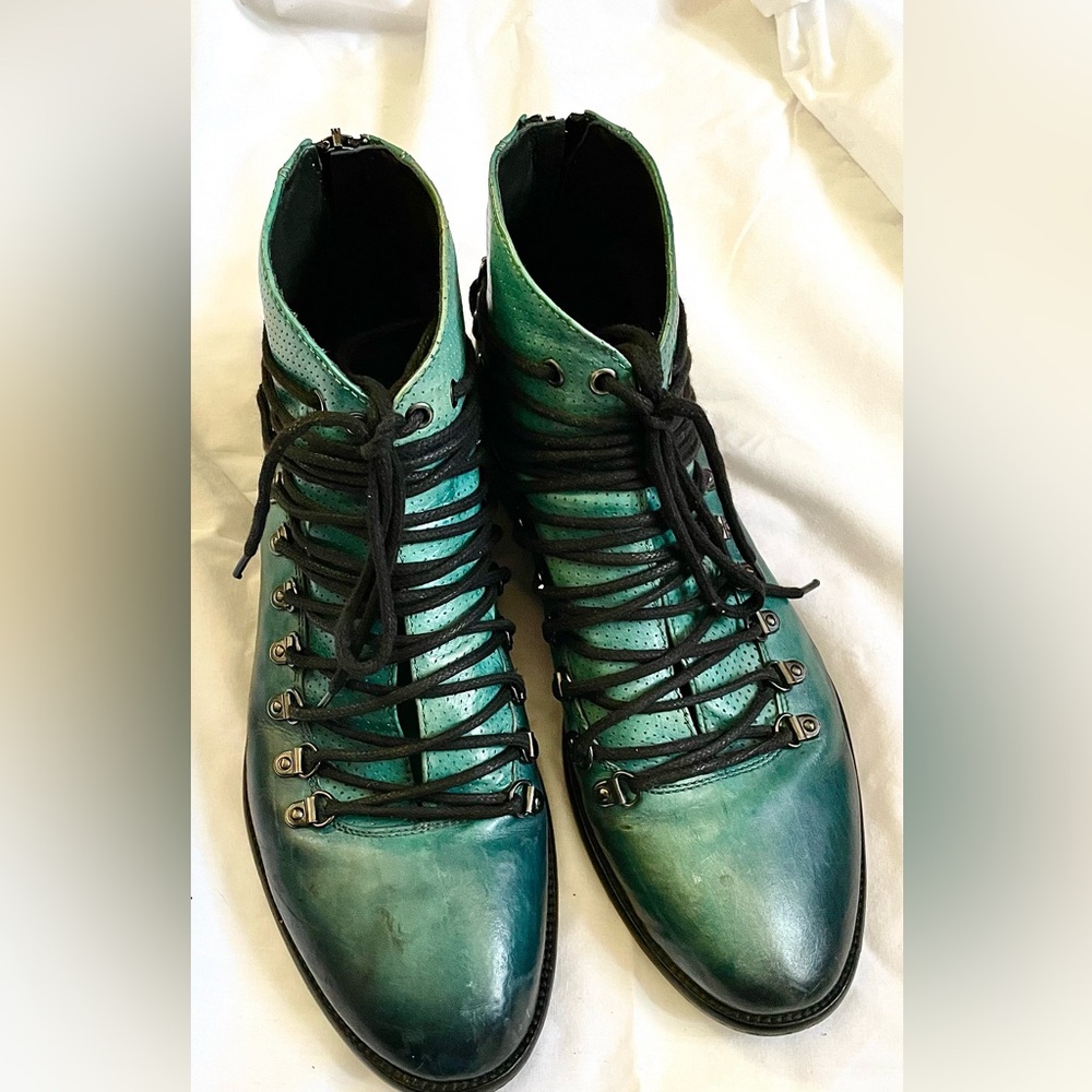 One pair unique Italian ankle boots, EU size 41. Leather upper and sole.